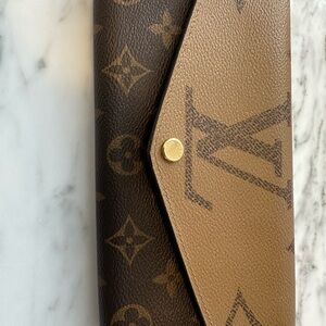 Authentic Louis Vuitton Black and Gold Wallet